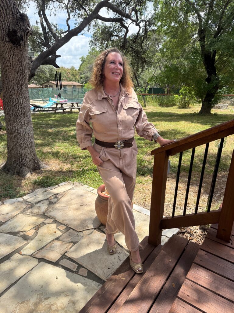 Shelby standing outdoors beside wooden steps