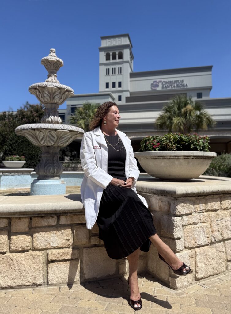 Shelby beside a fountain