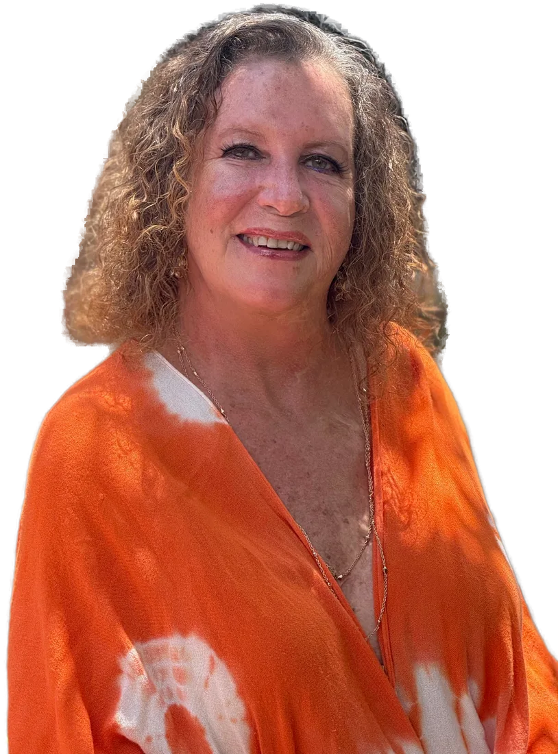 Shelby Maverick Miller smiling outdoors in an orange and white outfit